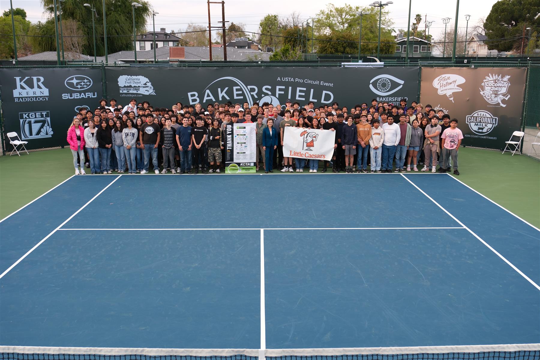 The Boys Varsity and JV Tennis teams visited the Bakersfield Racquet Club to watch the Men's Tennis Open and had the opportunity to take a picture with Mayor Goh.